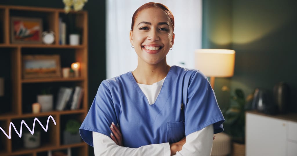 Smiling healthcare worker in blue scrubs, representing fast and fair payroll loan approvals for medical professionals.