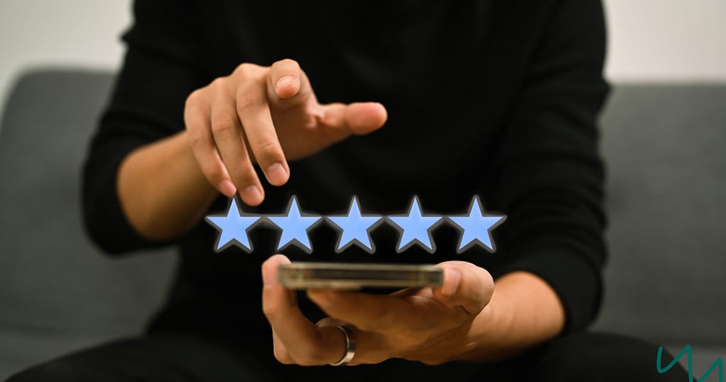 Customer giving a five-star rating on a phone, representing positive Salarly reviews and borrower satisfaction.
