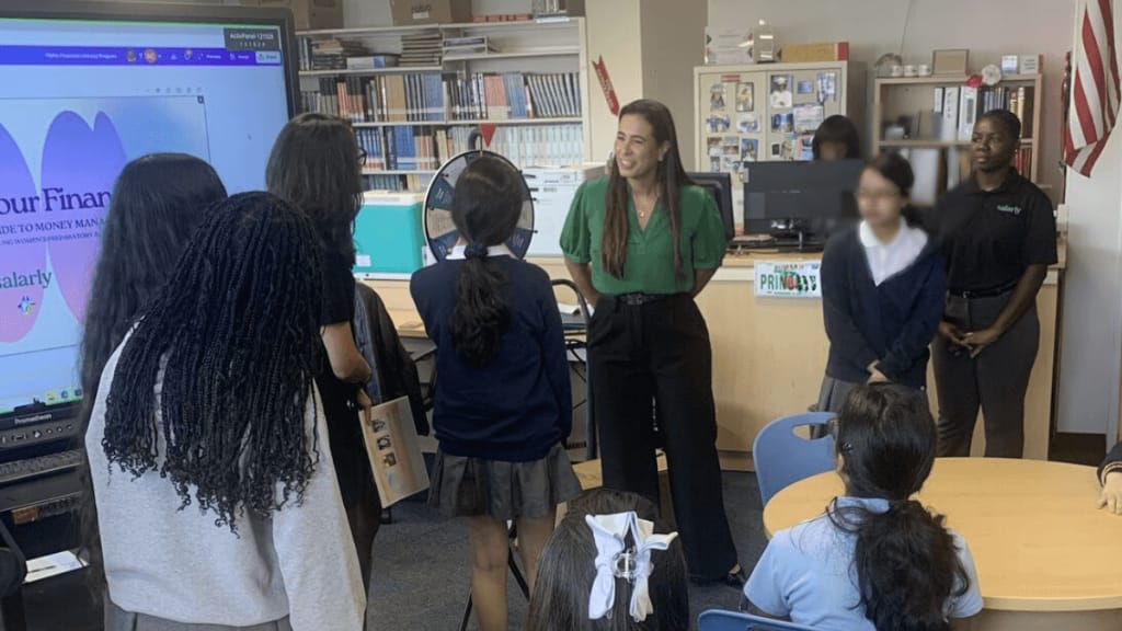 salarly team at the school visit presenting to students