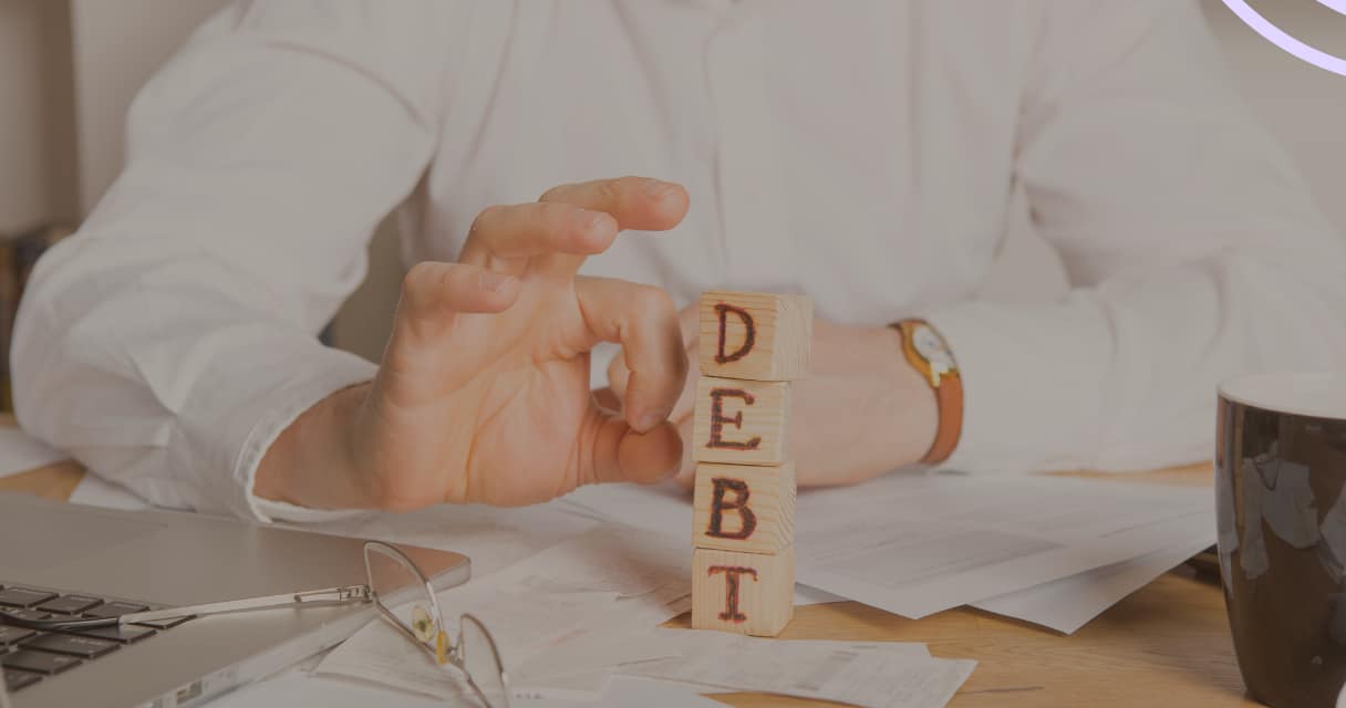 picture of staked letters spelling the word debt to help introduce topic of what is DTI