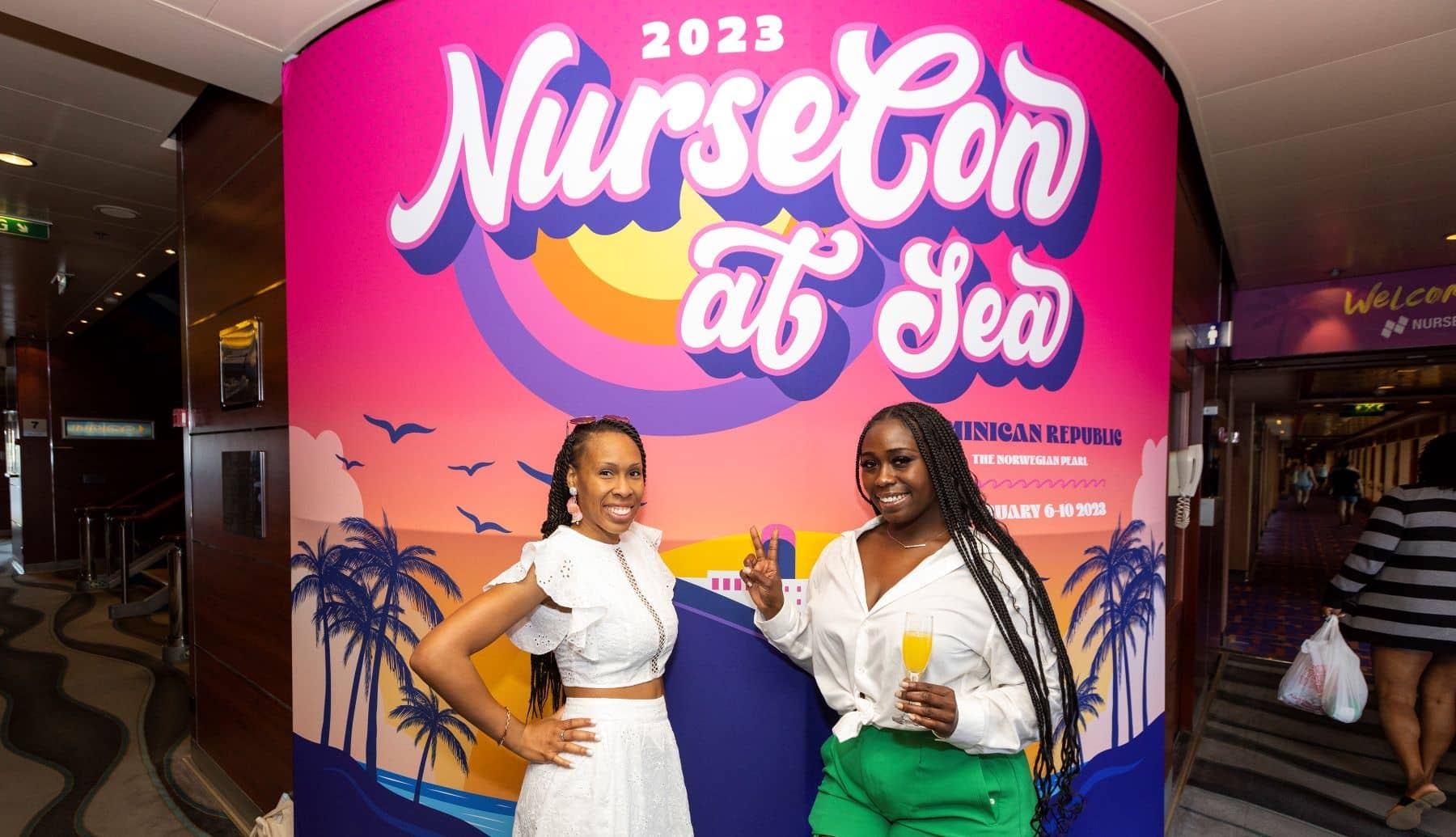 NurseCon at Sea two woman smiling and drinking at the cruise for nurses