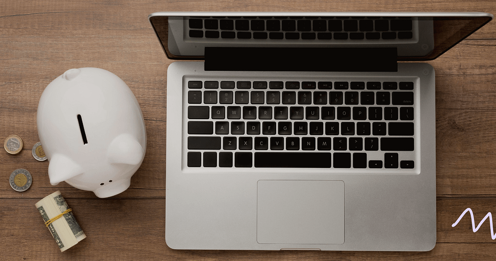 computer and piggy bank reminding tech-powered lending