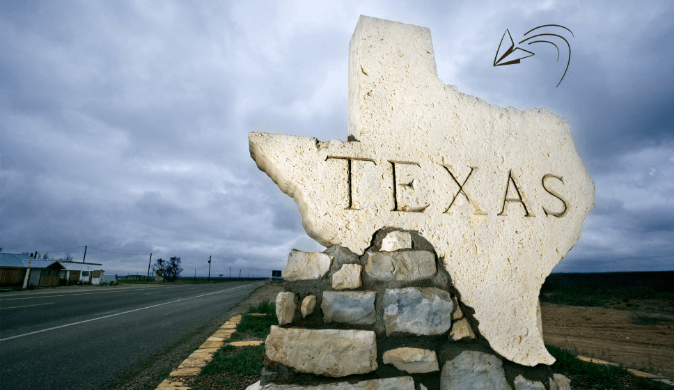 Texas state sign made of stone along a roadside." Caption: "Texas welcomes healthcare professionals to explore payroll loan options tailored to their needs." Description: "A stone sign in the shape of Texas by the roadside, representing the state’s welcoming approach to financial solutions for healthcare workers. This image reflects the stability and reliability of payroll loans designed specifically for Texas residents.